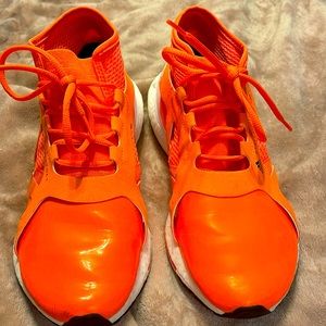 Adidas by Stella McCartney ultraboost sneakers.  Color: Orange and white. Size 8